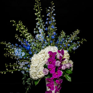 Delphinium, Hydrangea and purple roses