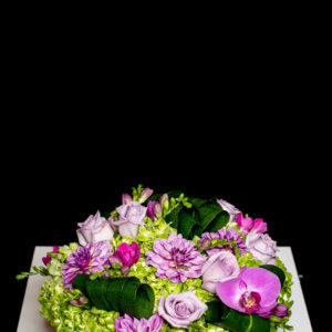 mounded green hydrangea, purple roses and dahlias